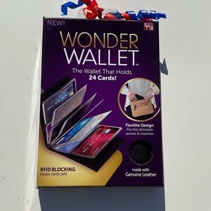 “New” As Seen On T.V.  The Wonder Wallet. Black. RFID Blocking.  Holds 24 Cards!